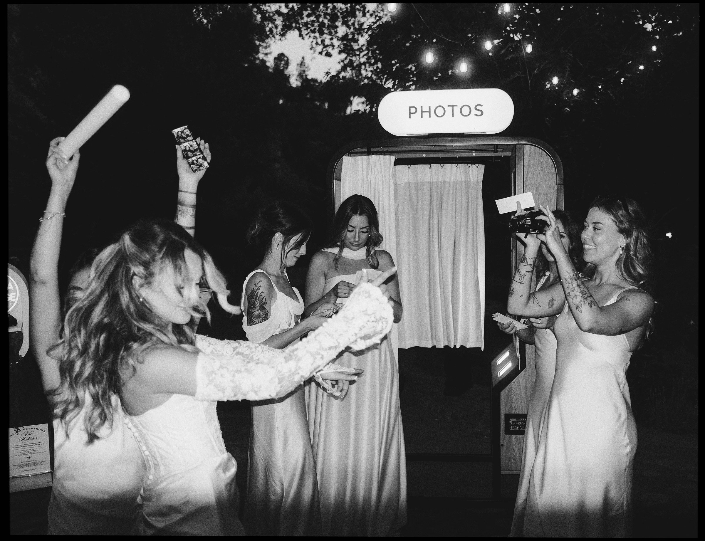Wedding guests celebrating around the Shutter Gold photo booth