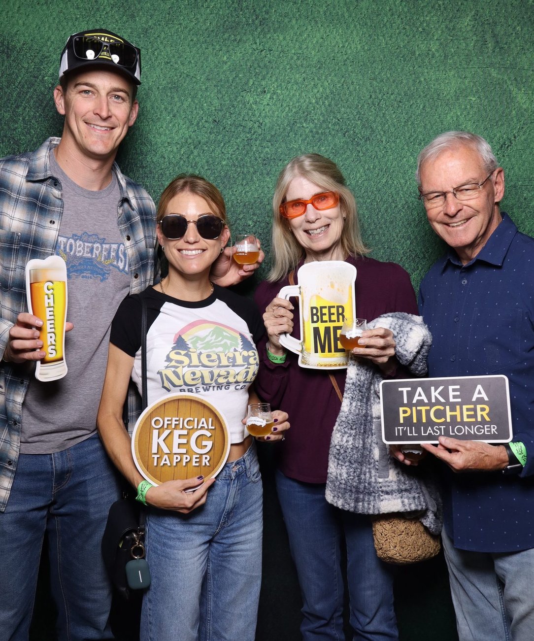 Guests with drink props at a company picnic