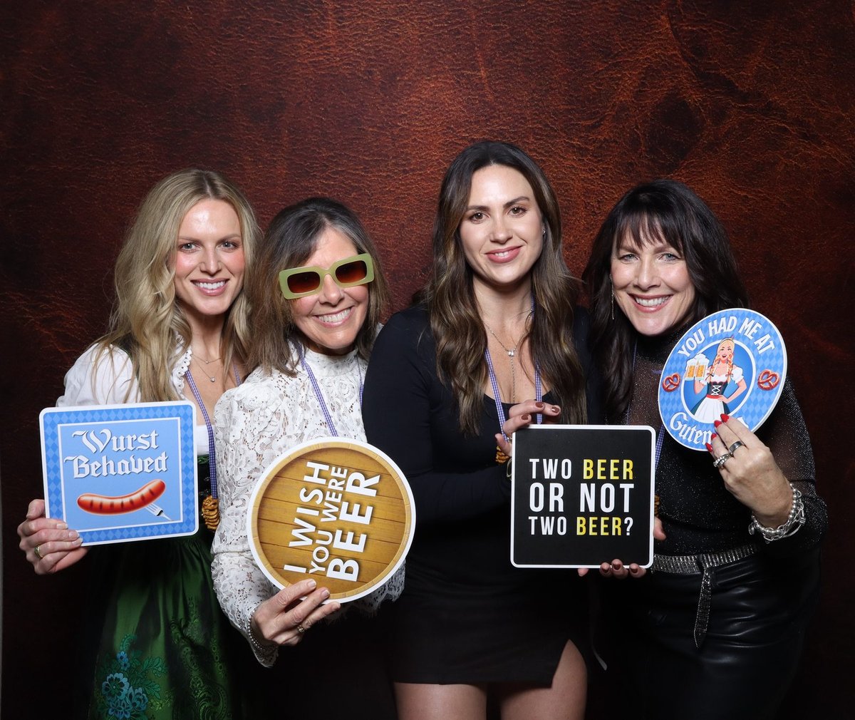 Friends holding beer-hall props in the Shutter Gold booth