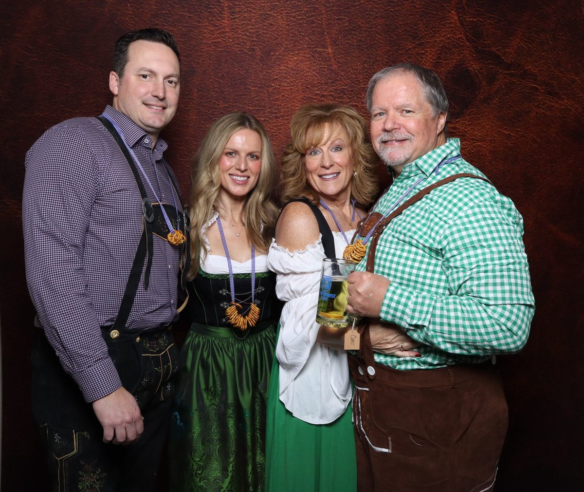 Four guests in beer hall dress at the booth