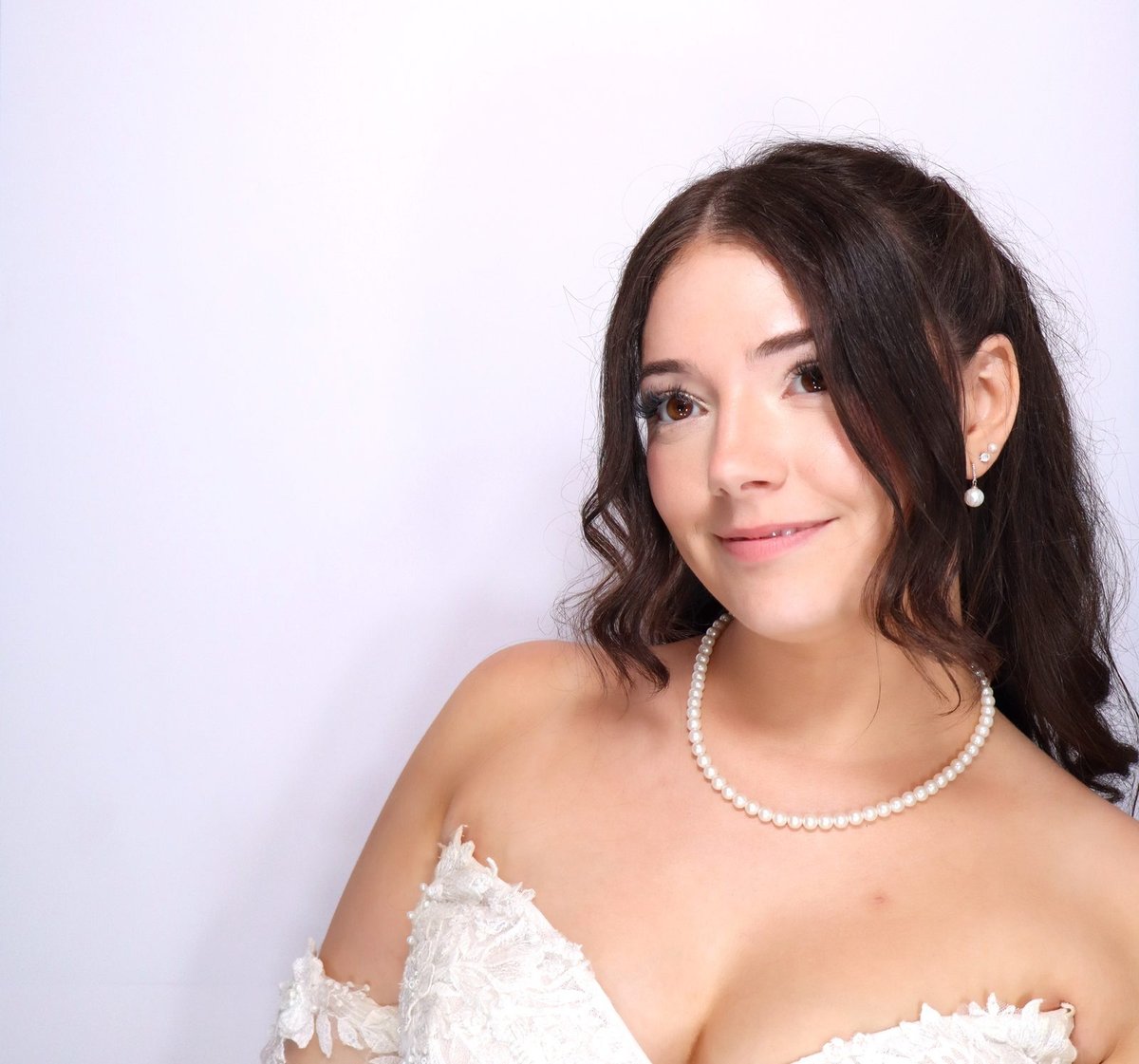A bride smiling in the booth