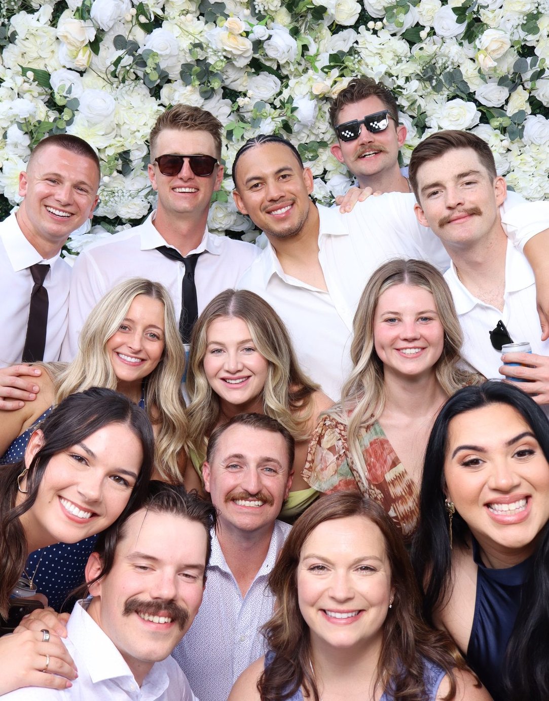 The wedding party packed into the booth
