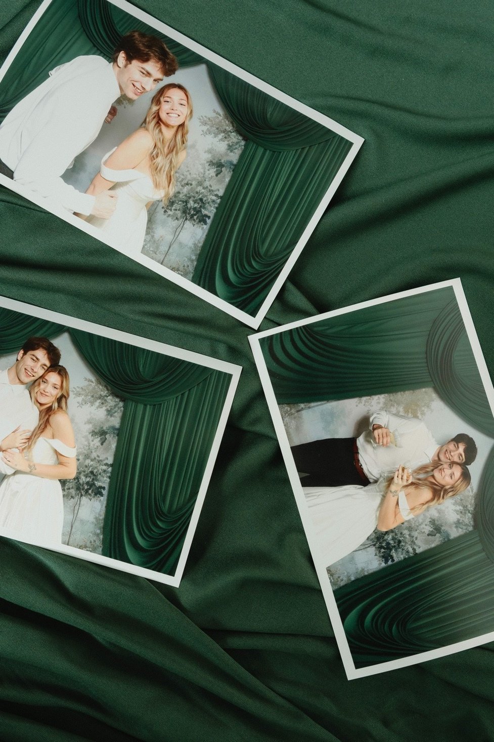 Finished photo booth prints laid out on green velvet